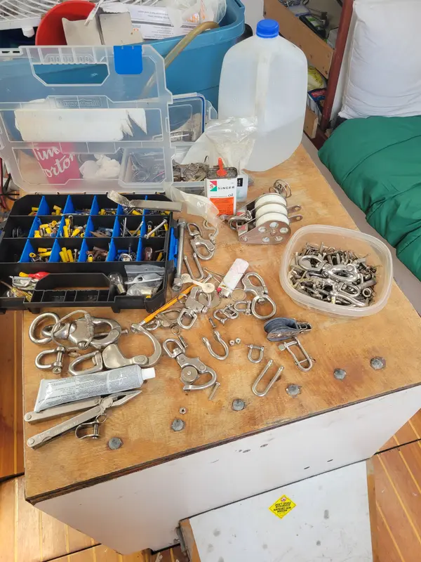 Shackles, blocks and fittings laid out on a chart table